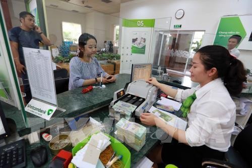 Giá USD tại Vietcombank 21/12 giảm 40 đồng. Ảnh minh họa: Trần Việt - TTXVN