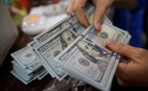 Tỷ giá USD hôm nay 14/1 tại các ngân hàng thương mại tăng so với ngày hôm qua. Ảnh minh họa: Reuters/TTXVN phát